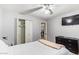Bedroom with ceiling fan, dresser and tiled floors at 10096 N 63Rd Ave, Glendale, AZ 85302