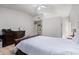 Bedroom with dark wood furniture and tiled floors at 10096 N 63Rd Ave, Glendale, AZ 85302
