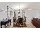 Dining room with a chandelier and six-chair table at 10096 N 63Rd Ave, Glendale, AZ 85302