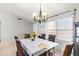Dining area with six chairs and window with blinds at 10096 N 63Rd Ave, Glendale, AZ 85302