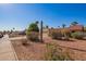 Front yard view of single story home with desert landscaping at 10096 N 63Rd Ave, Glendale, AZ 85302