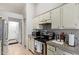 View of kitchen with stainless steel appliances and granite countertops at 10096 N 63Rd Ave, Glendale, AZ 85302