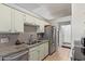 Kitchen features granite countertops and stainless steel appliances at 10096 N 63Rd Ave, Glendale, AZ 85302