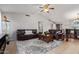 Living room with leather sofas, coffee table, and high ceiling at 10096 N 63Rd Ave, Glendale, AZ 85302