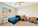 Bedroom with a blue bedspread, work desk and a globe at 10448 E Verbina E Ln, Florence, AZ 85132