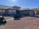 Well-maintained front yard with gravel landscaping and fountain at 14315 W Colt Ln, Sun City West, AZ 85375