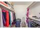 Well-organized closet with hanging clothes and shelves at 18010 N 135Th Dr, Sun City West, AZ 85375