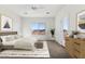Bright bedroom with a queen bed, large window, and mountain views at 20236 W Highland Ave, Litchfield Park, AZ 85340