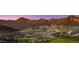 Community view showcasing homes and mountain backdrop at 20236 W Highland Ave, Litchfield Park, AZ 85340