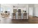 Modern kitchen with white cabinets, stainless steel appliances, and an island at 20236 W Highland Ave, Litchfield Park, AZ 85340