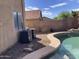 Two AC units located near the pool and home at 22130 N Van Loo Dr, Maricopa, AZ 85138