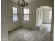 Bright dining room with carpet flooring and chandelier at 22130 N Van Loo Dr, Maricopa, AZ 85138