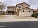 Two-story house with a landscaped yard and attached two-car garage at 22130 N Van Loo Dr, Maricopa, AZ 85138