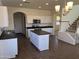 Kitchen with an island, stainless steel appliances, and dark countertops at 22130 N Van Loo Dr, Maricopa, AZ 85138