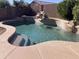Inviting kidney-shaped pool with a waterfall feature at 22130 N Van Loo Dr, Maricopa, AZ 85138