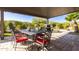 Covered patio with dining area and built-in grill at 27437 W Yukon Dr, Buckeye, AZ 85396