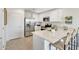 Modern kitchen with stainless steel appliances and white cabinetry at 36615 W Mondragone Ln, Maricopa, AZ 85138