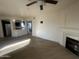 Living area with fireplace, kitchen peek, and wood-look floors at 3848 N 3Rd N Ave # 2010, Phoenix, AZ 85013