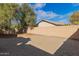 Backyard with gravel and block wall. Room for activities at 43842 W Elizabeth Ave, Maricopa, AZ 85138