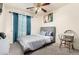 Bedroom with a double bed, ceiling fan and desk at 43842 W Elizabeth Ave, Maricopa, AZ 85138