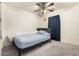 Bedroom with a double bed and ceiling fan at 43842 W Elizabeth Ave, Maricopa, AZ 85138
