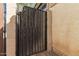 Wooden gate providing access to backyard at 43842 W Elizabeth Ave, Maricopa, AZ 85138