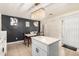 Eat-in kitchen with an island and modern chandelier at 43842 W Elizabeth Ave, Maricopa, AZ 85138