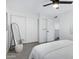 Bedroom with white closet doors and grey wood-look floors at 4610 N 68Th St # 417, Scottsdale, AZ 85251