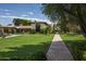 Brick pathway leading to a beautiful home with lush landscaping at 5815 N Saguaro Rd, Paradise Valley, AZ 85253