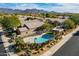 Community pool and clubhouse nestled among desert landscaping with mountain backdrop at 8926 E Calle Buena Vis, Scottsdale, AZ 85255