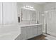 Another view of the bathroom, highlighting the tub, shower, and vanity area at 9622 S 46Th Ln, Laveen, AZ 85339