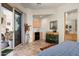 Bedroom with sliding door to backyard and wet bar at 9722 E Mark Ln, Scottsdale, AZ 85262