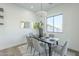 Modern dining room with a six-person table and access to backyard at 9872 W Black Hill Rd, Peoria, AZ 85383