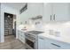 Bright kitchen with white cabinets, stainless steel appliances, and subway tile backsplash at 9872 W Black Hill Rd, Peoria, AZ 85383