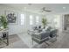 Bright living room with comfy seating and large windows at 9872 W Black Hill Rd, Peoria, AZ 85383