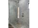 Spa-like shower with a glass enclosure and pebble floor at 9872 W Black Hill Rd, Peoria, AZ 85383