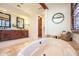 Spa-like bathroom with soaking tub, double vanity, and ample storage at 10575 E Rising Sun Dr, Scottsdale, AZ 85262