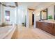 Spa-like bathroom with soaking tub, double vanity, and ample storage at 10575 E Rising Sun Dr, Scottsdale, AZ 85262