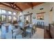 Bright dining room with wooden table and chairs, adjacent to the living area at 10575 E Rising Sun Dr, Scottsdale, AZ 85262