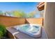 Private hot tub nestled in a walled-in patio area at 10575 E Rising Sun Dr, Scottsdale, AZ 85262
