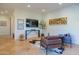 Spacious living room with a fireplace and hardwood floors at 10575 E Rising Sun Dr, Scottsdale, AZ 85262