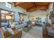 Open living space with hardwood floors, high ceilings, and access to patio at 10575 E Rising Sun Dr, Scottsdale, AZ 85262