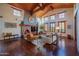 Living room with a brick fireplace and hardwood floors at 10575 E Rising Sun Dr, Scottsdale, AZ 85262