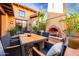 Inviting patio with fireplace and dining area, perfect for outdoor entertaining at 10575 E Rising Sun Dr, Scottsdale, AZ 85262