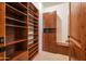 Spacious walk-in closet, built-in shelves and drawers at 10575 E Rising Sun Dr, Scottsdale, AZ 85262