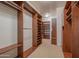 Large walk-in closet with ample shelving and hanging space at 10575 E Rising Sun Dr, Scottsdale, AZ 85262