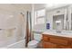 Clean bathroom featuring a shower/tub combo and wood vanity at 13703 W Pavillion Dr, Sun City West, AZ 85375