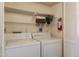 Laundry room with washer, dryer, and shelving at 14645 N Fountain Hills Blvd # 107, Fountain Hills, AZ 85268