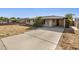 Ranch home with a long driveway and carport at 1465 E 2Nd Ave, Mesa, AZ 85204