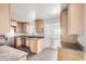 View of kitchen with stainless steel appliances and wood cabinets at 1465 E 2Nd Ave, Mesa, AZ 85204